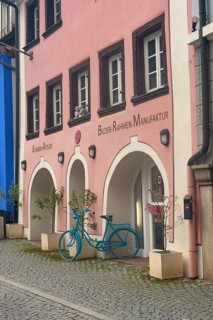 Donaueschingen, Germany. 28th September 2024 Colourful shops and cafes on the twon square of