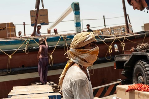 Dubai, United Arab Emirates. June 29th 2019 Foreign workers unloading cargo from Dhow boats Dubai