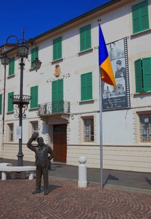 Italy, village of Brescello, the town hall, known from Don Camillo and Peppone, with a bronze