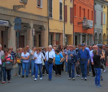 Group of visitors in the town of Don Camillo and Peppone, Brescello, Emilia-Romagna, Italy