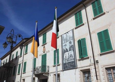 Italy, village of Brescello, the town hall, known from Don Camillo and Peppone, with a bronze