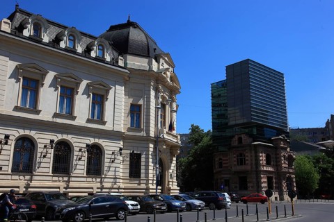 Romania, capital Bucharest, Bucuresti, building near Revolution Square, on the right the House of