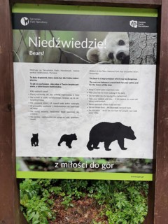 Informative sign in Tatra National Park about bear watching with instructions, Zakopane, hiking in