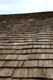 Close-up of a traditional wooden shingle roof, building materials, wood shingles