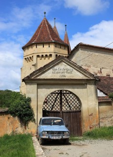 The fortified church of Seica Mica, German Kleinschelken, in front of it a Daccia 1300, a community
