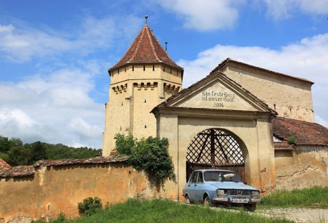 The fortified church of Seica Mica, German Kleinschelken, in front of it a Daccia 1300, a community