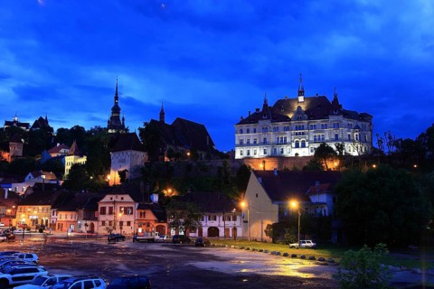 Romania, view of the town hall, monastery church and hour tower in the historic old town of