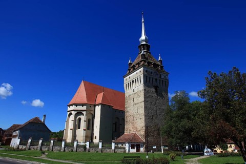 Romania, the church tower and church of Saschiz, German Keisd, a community in Mures County,