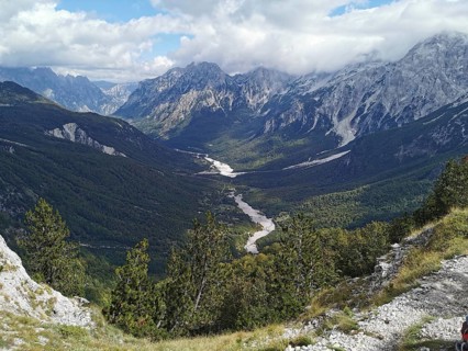Panorama, far-reaching view of a valley with a river surrounded by majestic mountains, Peaks of the