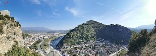 Panorama, panoramic view of a castle, including river and city, in a mountainous green landscape,