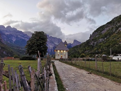 Lonely church in Theth, in a mountainous landscape at dusk with peaceful atmosphere, Peaks of the