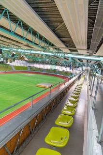 Elevated stand with green seats and view of a sports hall, Sindelfingen Glass Palace, Böblingen