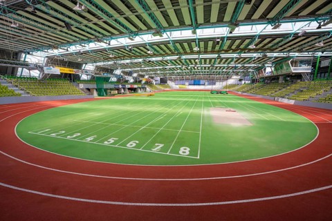 Round green running track with numbered markings in a sports hall, Glaspalast Sindelfingen,