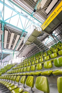 Yellow seats in a stand in a modern sports hall, Glaspalast Sindelfingen, Böblingen district,