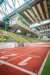 Sports hall with red running track and green seats in the stands, Sindelfingen Glass Palace,