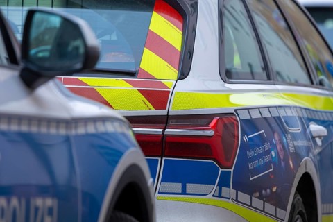 Symbolic image of police operation: close-up of police emergency vehicles