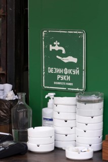 Information sign for hand disinfection in a garden restaurant, Lviv, Ukraine