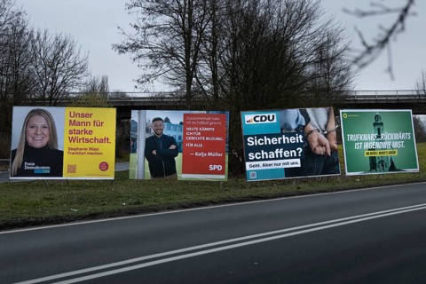 Large election posters are standing on a street in the northwest of Frankfurt. The Hessian state