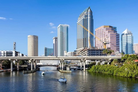 Tampa skyline with skyscrapers and bridge over Hillsborough River downtown in Tampa, USA