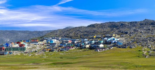 Typical architecture of Greenland Ilulissat with colored houses located near fjords and icebergs