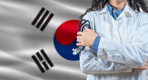Healthcare professional with South Korea flag background. Professional doctor holding stethoscope