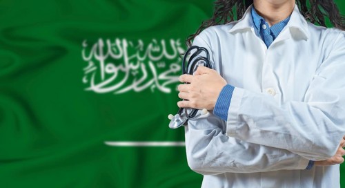 Healthcare professional with Saudi Arabia flag background. Professional doctor holding stethoscope