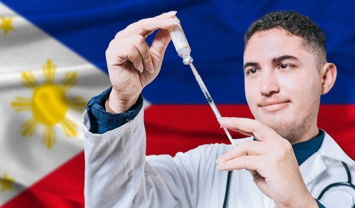 Doctor holding syringe on Philippines flag background. Medical professional holding syringe with
