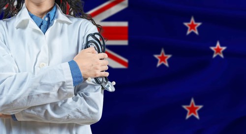 Healthcare professional with New Zealand flag background. Professional doctor holding stethoscope