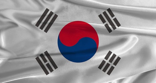 Flag of South Korea with fabric textured background. Close up of National flag of South Korea with