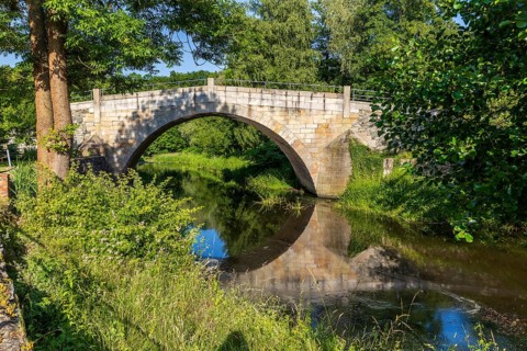 Historic arched bridge over the Mandau in Hainewalde, Upper Lusatia, Saxony, Germany