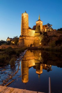Old water art and St. Michael's Church are reflected in the Spree, night view, Bautzen, Saxony,