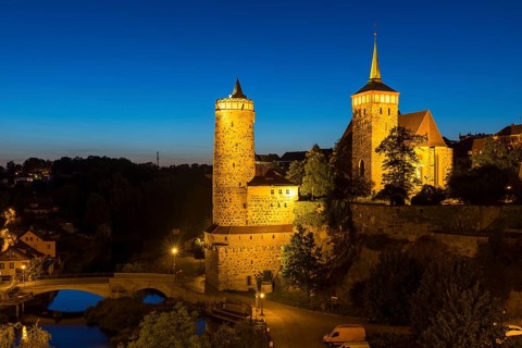 City view at night with Spree, Old Water Art and St. Michael's Church, Bautzen, Upper Lusatia,
