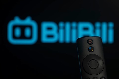 Dhaka, Bangladesh- 21 Jan 2026: Close-up of a smart TV remote control against a blurred Bilibili