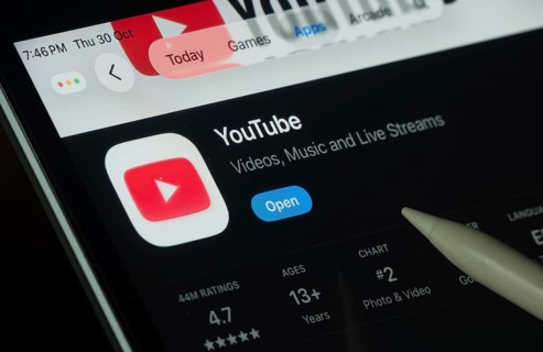 Dhaka, Bangladesh- 30 Oct 2025: Youtube app displayed on a iPad screen in dark mode with a digital