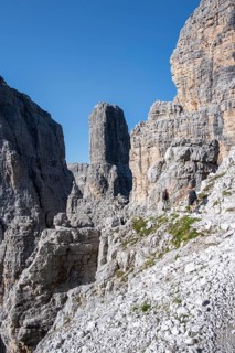 Mountaineers on the Bocchette Centrale band trail, via ferrata in the Brenta Mountains,