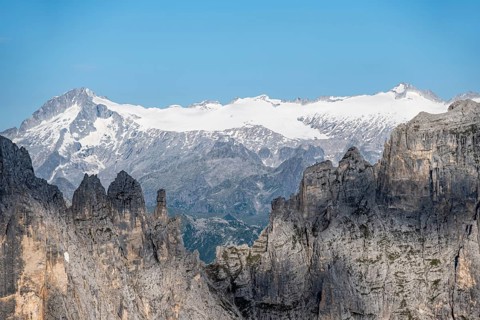 Adamello mountain peak with glacier, in front Brenta Mountains, Brenta-Adamello Natural Park,