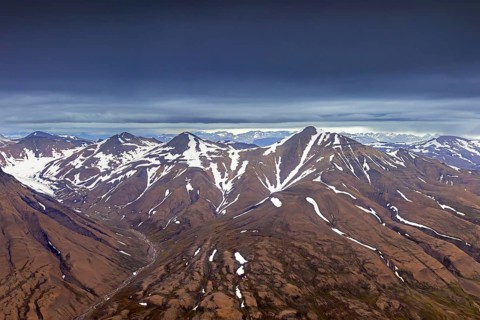 Aerial view over Adventdalen in summer, 30-kilometre valley and river Adventdalselva on the island