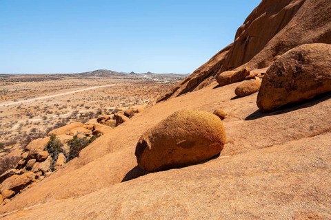 Extensive desert landscape with distinctive rock formations and endless expanse, Spitzkoppe,