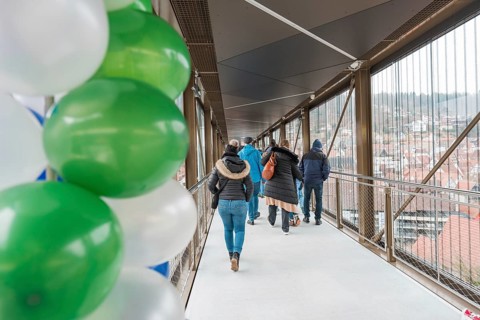 A walkway with people and balloons overlooks the city, opening of the Hermann Hesse Railway, Calw,
