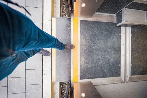 Person boarding a train, view from above of the entrance, Siemens Micro Plus B battery electric