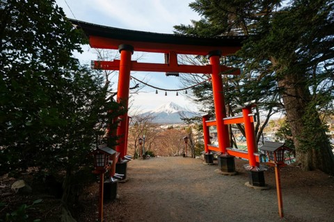 View through red torii of Mount Fuji volcano, Arakura Fuji Sengen Shrine, Arakurayama Sengen Park,