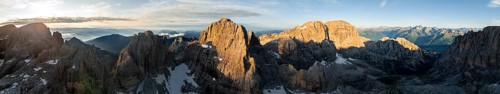 Impressive mountain peaks of the Brenta Mountains, sunrise, 360 degree alpine panorama, aerial