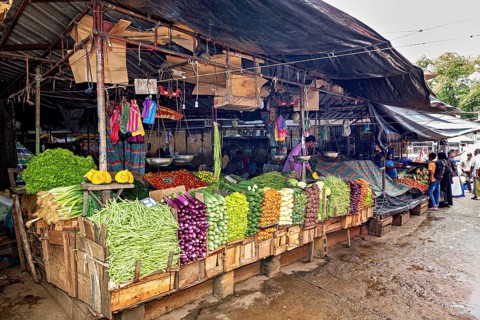 A market with a variety of fresh vegetables, presented in colorful stalls, The old market halls of
