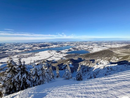 View of Forggensee and Bannwaldsee with snow in winter, ski tour on Tegelberg in winter, Schwangau,