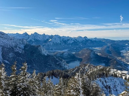 View of snowy mountain landscape of the Allgäu Alps with Alpsee, Tegelberg in winter, Schwangau,