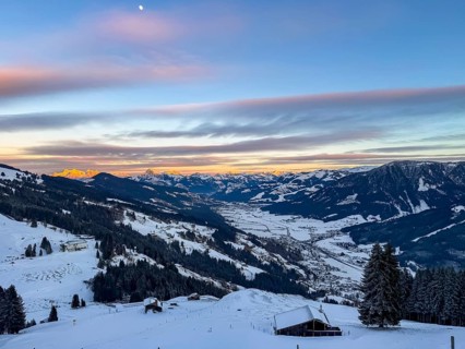 View of snowy valley and mountain landscape at sunset, Hochbrixen, Brixental, Kitzbühel Alps,