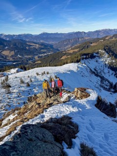 Three friends hiking trail to the summit of Feldalphorn, winter hiking, Kitzbühel Alps, Tyrol,