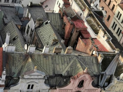 View from above of old roofs with tiles, chimneys and satellite dishes, Pilsen, Czech Republic