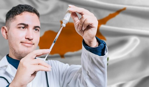 Doctor holding syringe on Cyprus flag background. Medical professional holding syringe with Cyprus