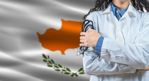 Healthcare professional with Cyprus flag background. Professional doctor holding stethoscope on
